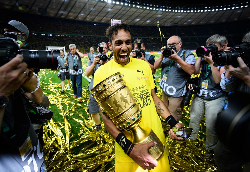 BERLIN, GERMANY - MAY 27: Pierre-Emerick Aubameyang of Dortmund celebrates with the trophy after winning the DFB Cup Final 2017 between Eintracht Frankfurt and Borussia Dortmund at Olympiastadion on May 27, 2017 in Berlin, Germany. (Photo by Matthias Hangst/Bongarts/Getty Images)