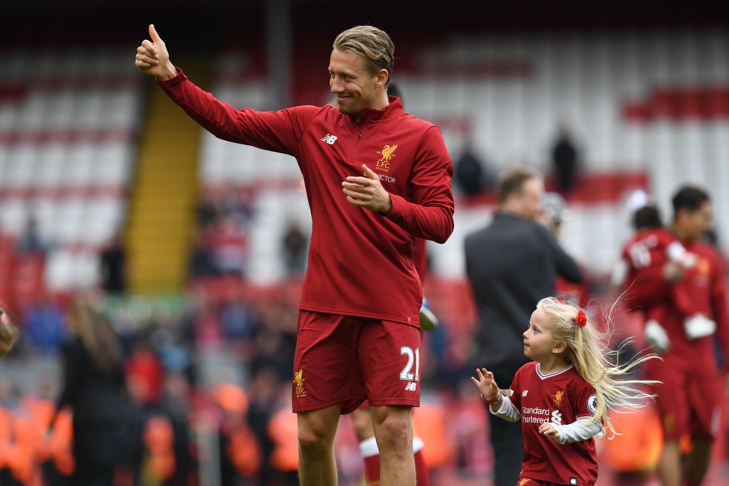 Liverpool's Brazilian midfielder Lucas Leiva applauds the fans following the English Premier League football match between Liverpool and Middlesbrough at Anfield in Liverpool, north west England on May 21, 2017. Liverpool won the match 3-0. / AFP PHOTO / Paul ELLIS / RESTRICTED TO EDITORIAL USE. No use with unauthorized audio, video, data, fixture lists, club/league logos or 'live' services. Online in-match use limited to 75 images, no video emulation. No use in betting, games or single club/league/player publications. / (Photo credit should read PAUL ELLIS/AFP/Getty Images)