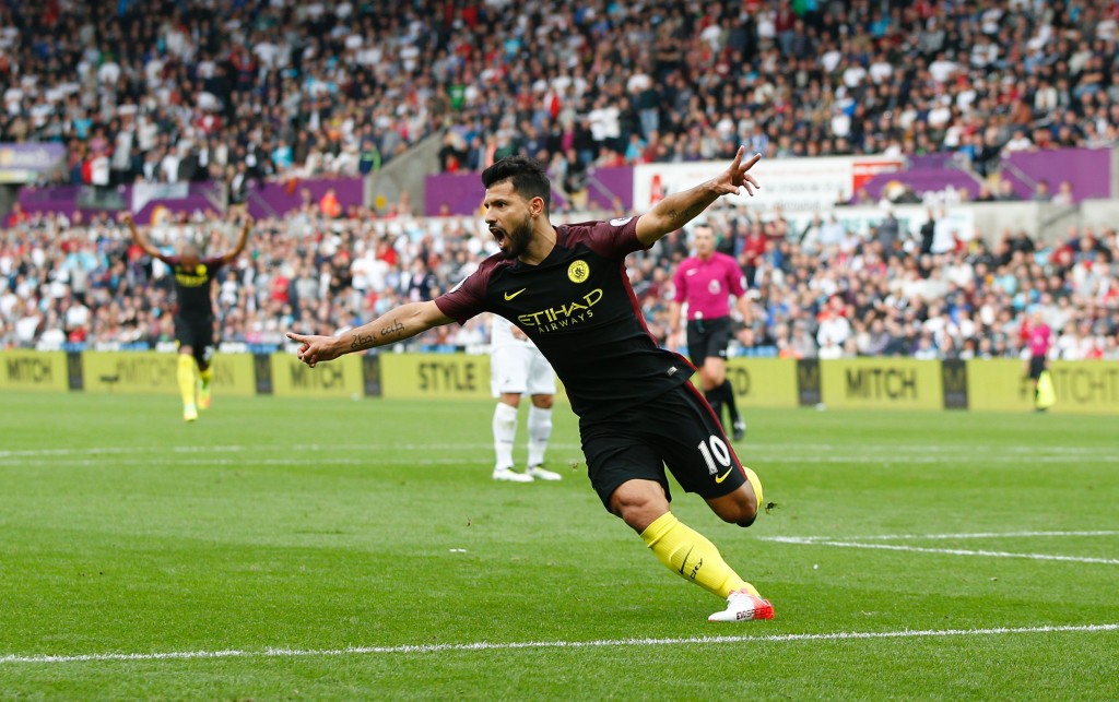 Manchester City's Argentinian striker Sergio Aguero celebrates scoring the opening goal during the English Premier League football match between Swansea City and Manchester City at The Liberty Stadium in Swansea, south Wales on September 24, 2016. / AFP / Adrian DENNIS / RESTRICTED TO EDITORIAL USE. No use with unauthorized audio, video, data, fixture lists, club/league logos or 'live' services. Online in-match use limited to 75 images, no video emulation. No use in betting, games or single club/league/player publications. / (Photo credit should read ADRIAN DENNIS/AFP/Getty Images)