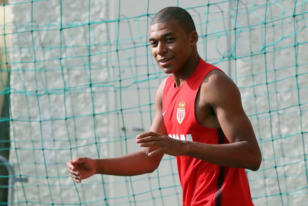 Monaco's French forward Kylian Mbappe arrives for a training session in La Turbie near Monaco on July 10, 2017. / AFP PHOTO / VALERY HACHE (Photo credit should read VALERY HACHE/AFP/Getty Images)