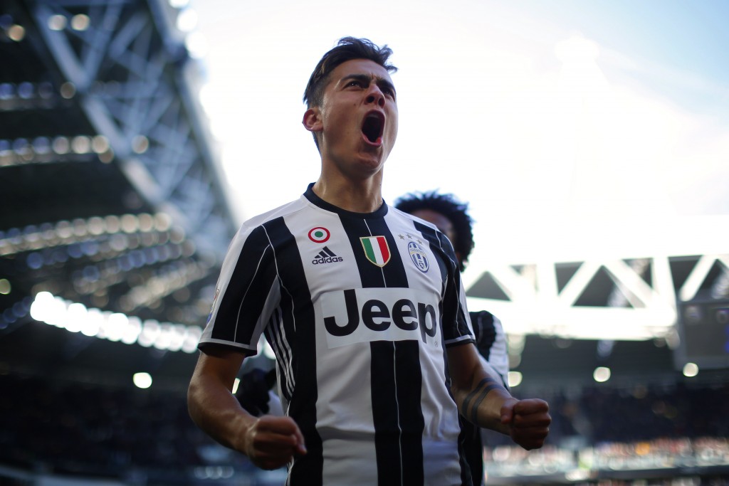 Juventus' forward Paulo Dybala from Argentina celebrates after scoring during the Serie A football match Juventus vs Lazio on January 22, 2017 at the Juventus Stadium in Turin. / AFP / MARCO BERTORELLO (Photo credit should read MARCO BERTORELLO/AFP/Getty Images)