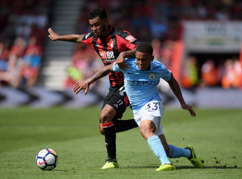 BOURNEMOUTH, ENGLAND - AUGUST 26: Joshua King of AFC Bournemouth and Gabriel Jesus of Manchester City battle for possession during the Premier League match between AFC Bournemouth and Manchester City at Vitality Stadium on August 26, 2017 in Bournemouth, England. (Photo by Mike Hewitt/Getty Images)