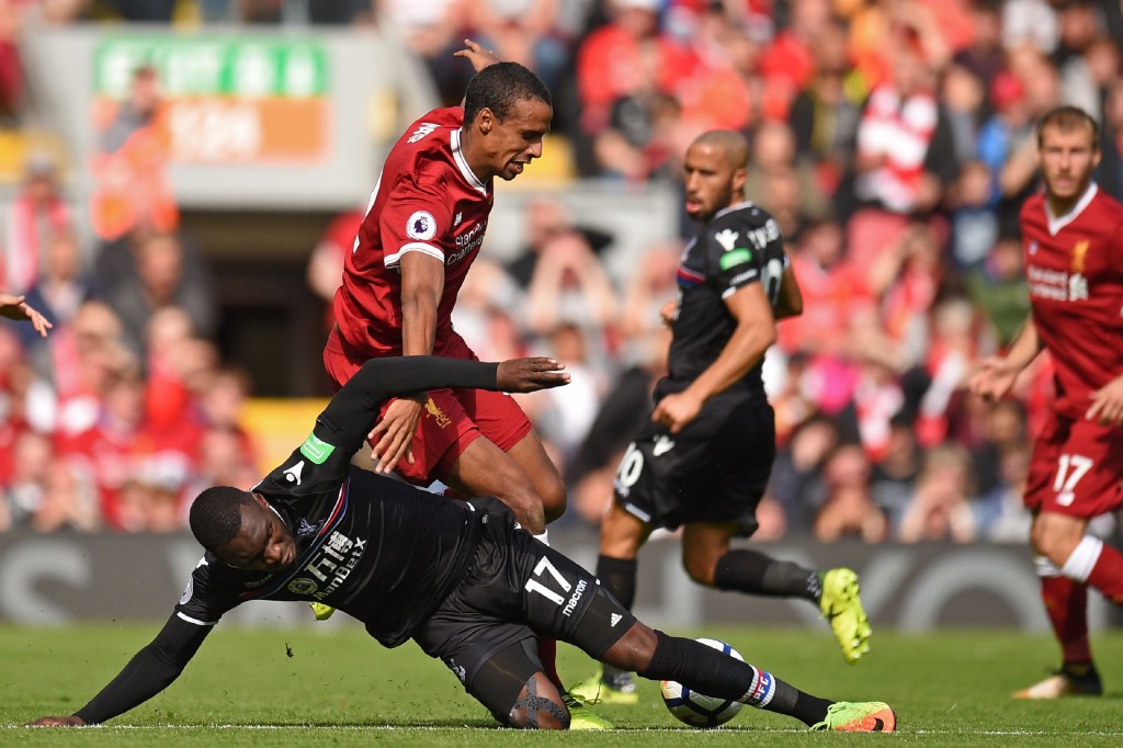 Crystal Palace's Zaire-born Belgian striker Christian Benteke (L) vies with Liverpool's German-born Cameroonian defender Joel Matip during the English Premier League football match between Liverpool and Crystal Palace at Anfield in Liverpool, north west England on August 19, 2017. / AFP PHOTO / Oli SCARFF / RESTRICTED TO EDITORIAL USE. No use with unauthorized audio, video, data, fixture lists, club/league logos or 'live' services. Online in-match use limited to 75 images, no video emulation. No use in betting, games or single club/league/player publications. / (Photo credit should read OLI SCARFF/AFP/Getty Images)