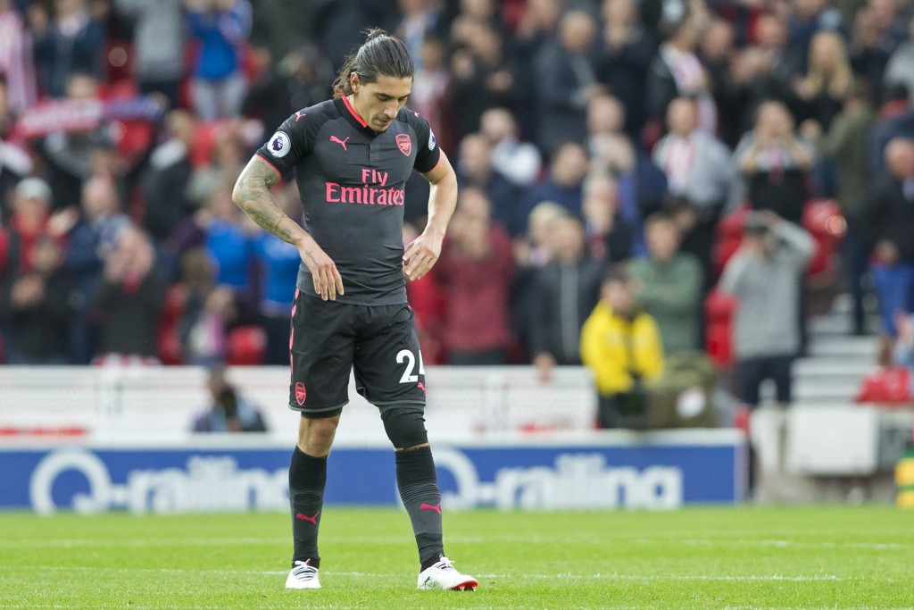 Arsenal's Spanish defender Hector Bellerin reacts to their defeat on the pitch after the English Premier League football match between Stoke City and Arsenal at the Bet365 Stadium in Stoke-on-Trent, central England on August 19, 2017. Stoke won the game 1-0. / AFP PHOTO / Roland Harrison / RESTRICTED TO EDITORIAL USE. No use with unauthorized audio, video, data, fixture lists, club/league logos or 'live' services. Online in-match use limited to 75 images, no video emulation. No use in betting, games or single club/league/player publications. / (Photo credit should read ROLAND HARRISON/AFP/Getty Images)