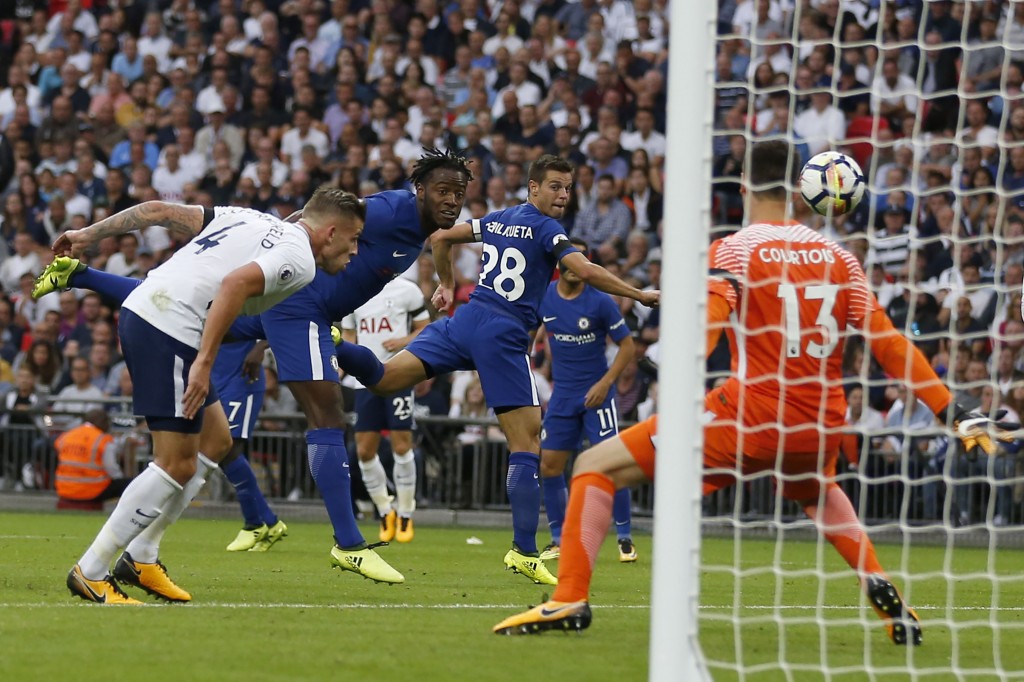 Chelsea's Belgian striker Michy Batshuayi (2L) scores an own goal during the English Premier League football match between Tottenham Hotspur and Chelsea at Wembley Stadium in London, on August 20, 2017. / AFP PHOTO / IKIMAGES / Ian KINGTON / RESTRICTED TO EDITORIAL USE. No use with unauthorized audio, video, data, fixture lists, club/league logos or 'live' services. Online in-match use limited to 45 images, no video emulation. No use in betting, games or single club/league/player publications. (Photo credit should read IAN KINGTON/AFP/Getty Images)