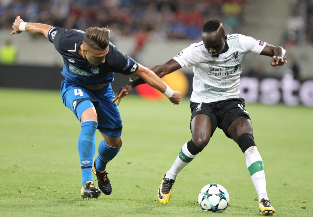 Hoffenheim's Bosnian defender Ermin Bicakcic (L) and Liverpool's Senegalese midfielder Sadio Mane vie for the ball during the Champions League football qualifier match TSG 1899 Hoffenheim vs Liverpool FC in Sinsheim, Germany, on August 15, 2017. / AFP PHOTO / Daniel ROLAND (Photo credit should read DANIEL ROLAND/AFP/Getty Images)