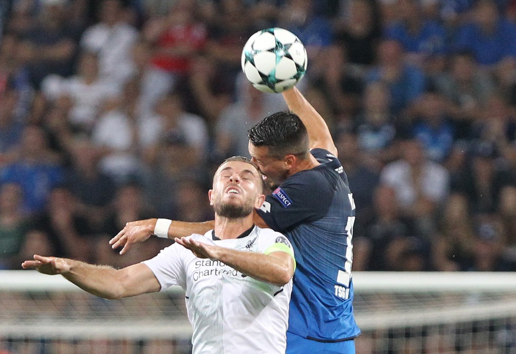 Hoffenheim's forward Sandro Wagner (R) and Liverpool's English midfielder Jordan Henderson (L) vie for the ball during the Champions League football qualifier match TSG 1899 Hoffenheim vs Liverpool FC in Sinsheim, Germany, on August 15, 2017. / AFP PHOTO / Daniel ROLAND (Photo credit should read DANIEL ROLAND/AFP/Getty Images)