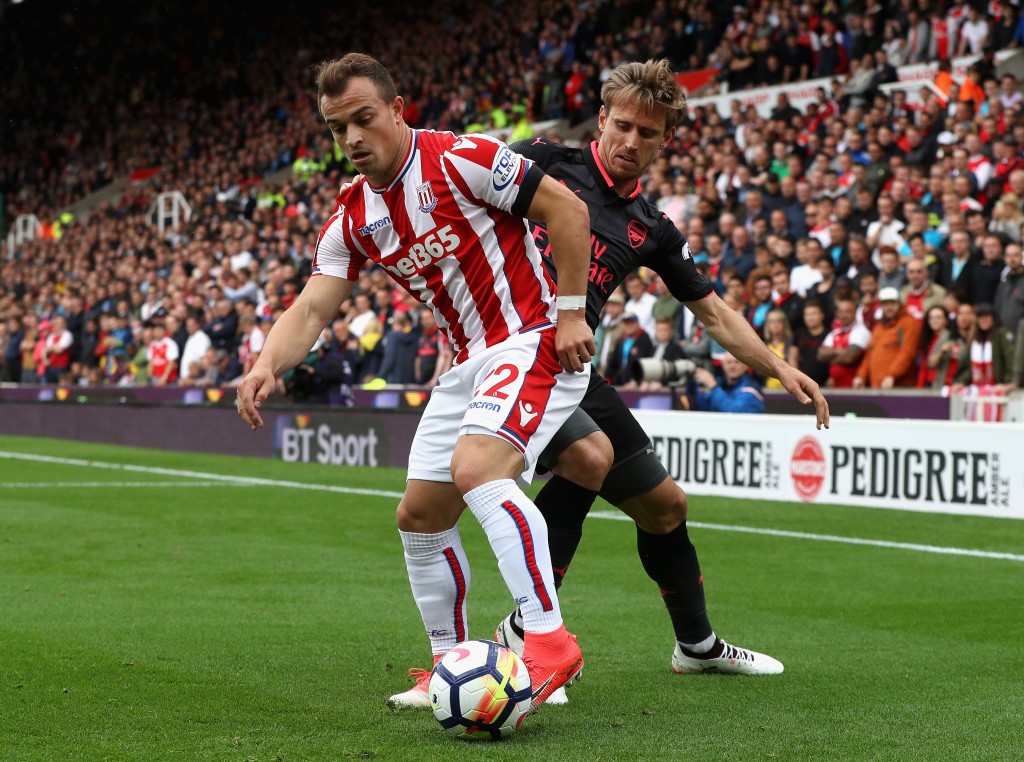 STOKE ON TRENT, ENGLAND - AUGUST 19: Xherdan Shaqiri of Stoke City and Nacho Monreal of Arsenal battle for possession during the Premier League match between Stoke City and Arsenal at Bet365 Stadium on August 19, 2017 in Stoke on Trent, England. (Photo by David Rogers/Getty Images)