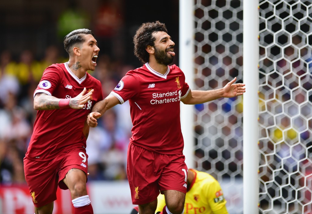 WATFORD, ENGLAND - AUGUST 12: Mohamed Salah of Liverpool celebrates scoring his sides third goal with Roberto Firmino of Liverpool during the Premier League match between Watford and Liverpool at Vicarage Road on August 12, 2017 in Watford, England. (Photo by Alex Broadway/Getty Images)