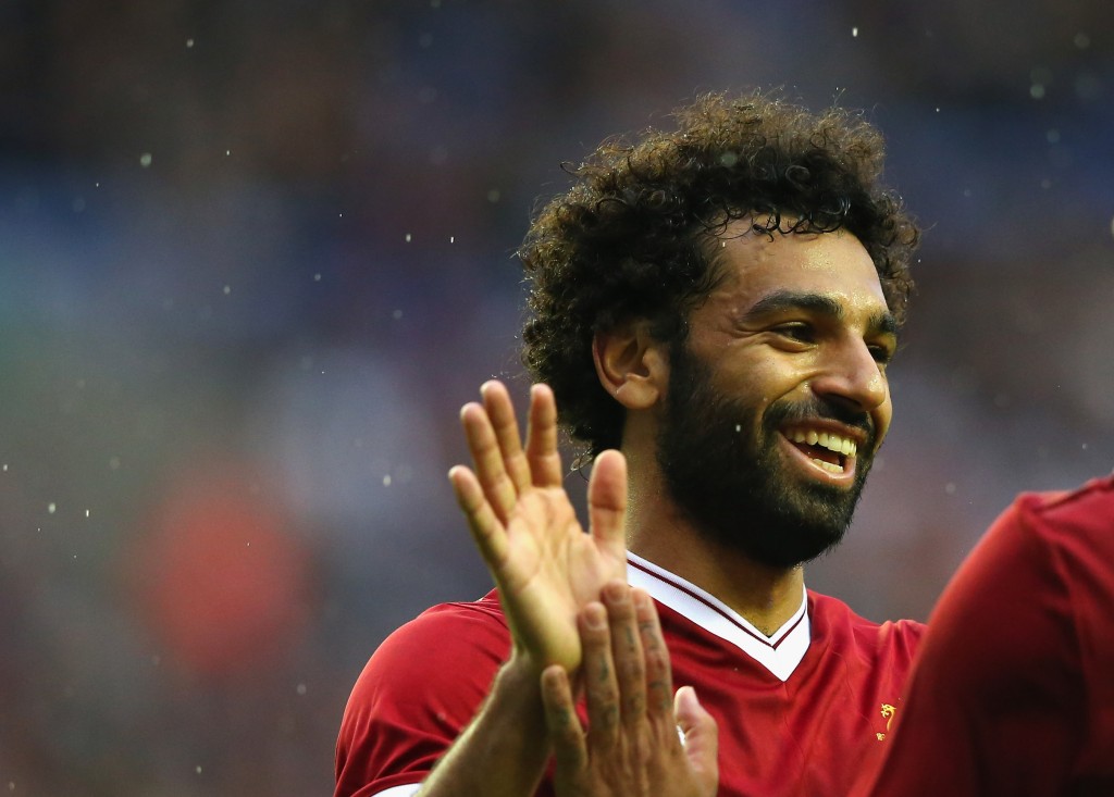 WIGAN, ENGLAND - JULY 14: Mohamed Salah of Liverpool celebrates with Roberto Firmino after scoring their first goal during the pre-season friendly match between Wigan Athletic and Liverpool at DW Stadium on July 14, 2017 in Wigan, England. (Photo by Alex Livesey/Getty Images)