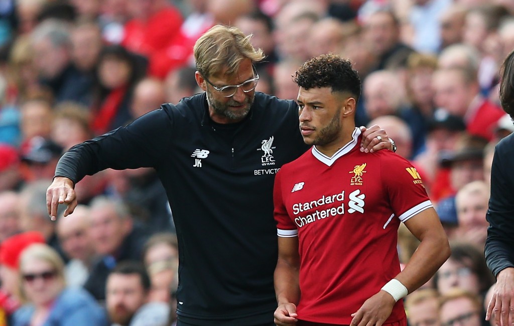 LIVERPOOL, ENGLAND - SEPTEMBER 16: Jurgen Klopp, Manager of Liverpool speaks to Alex Oxlade-Chamberlain of Liverpool before he comes on during the Premier League match between Liverpool and Burnley at Anfield on September 16, 2017 in Liverpool, England. (Photo by Alex Livesey/Getty Images)