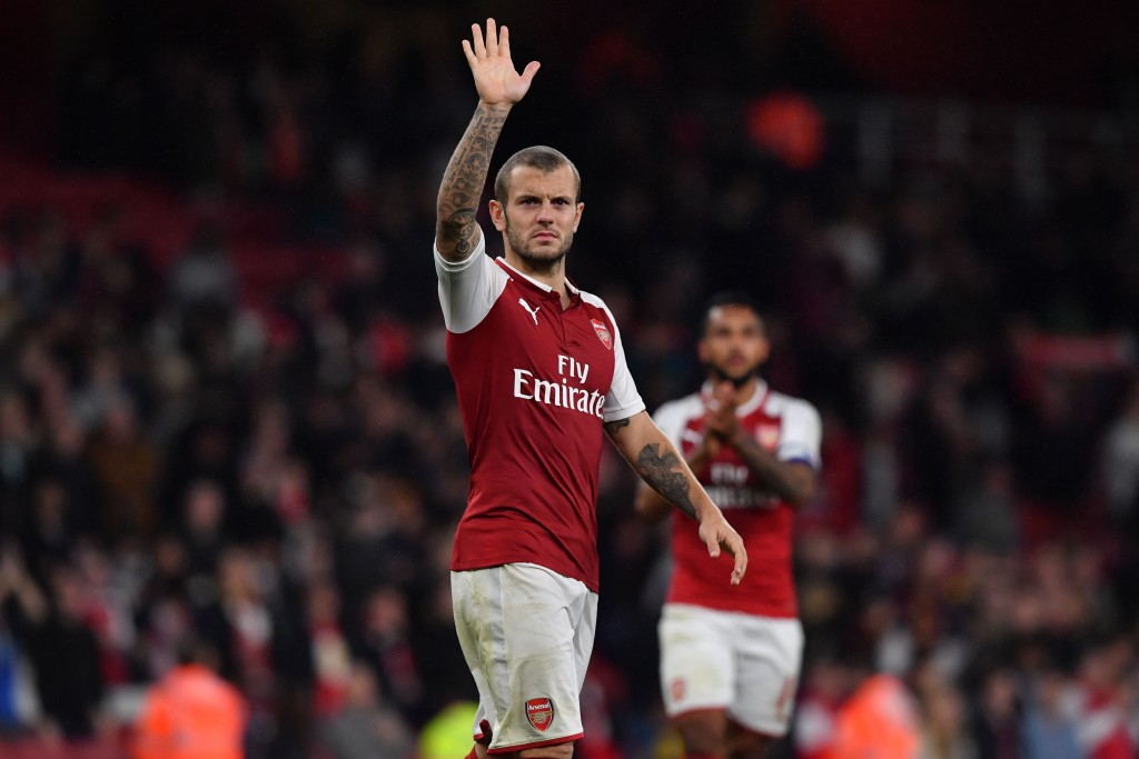 Arsenal's English midfielder Jack Wilshere gestures to supporters on the pitch after the English League Cup fourth round football match between Arsenal and Norwich City at The Emirates Stadium in London on October 24, 2017. Arsenal won the game 2-1 after extra time after the game finished 1-1. / AFP PHOTO / Ben STANSALL / RESTRICTED TO EDITORIAL USE. No use with unauthorized audio, video, data, fixture lists, club/league logos or 'live' services. Online in-match use limited to 75 images, no video emulation. No use in betting, games or single club/league/player publications. / (Photo credit should read BEN STANSALL/AFP/Getty Images)