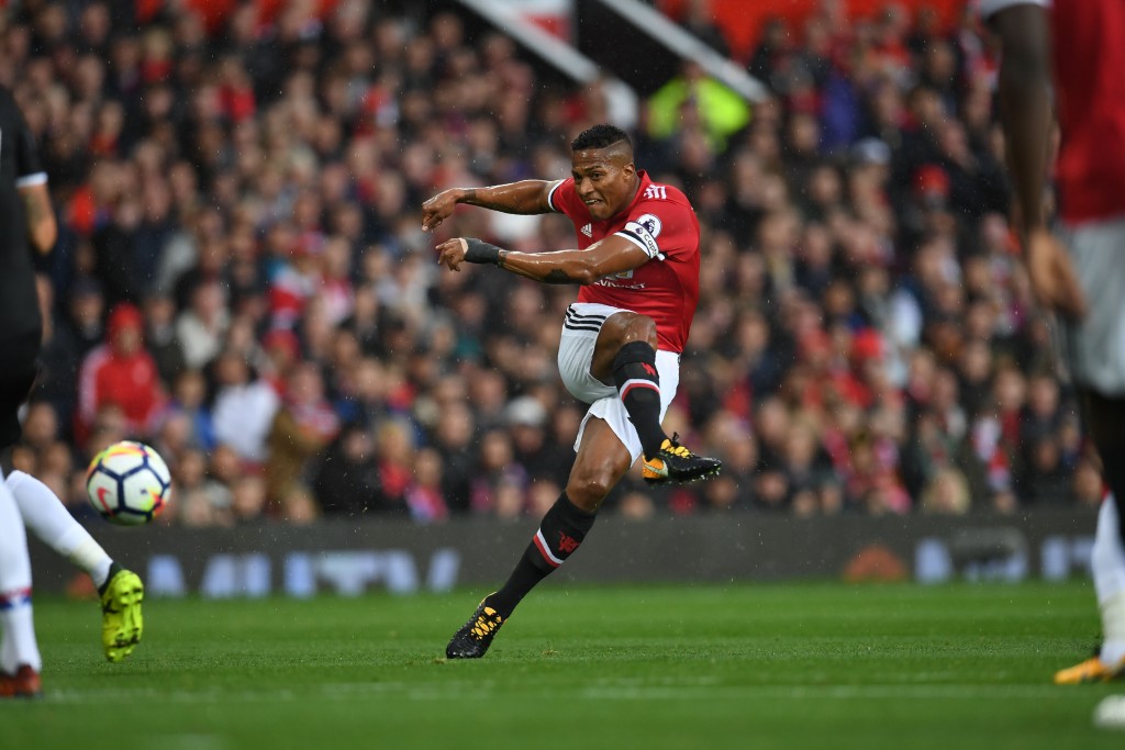 Manchester United's Ecuadorian midfielder Antonio Valencia takes a shot at goal during the English Premier League football match between Manchester United and Crystal Palace at Old Trafford in Manchester, north west England, on September 30, 2017. / AFP PHOTO / Paul ELLIS / RESTRICTED TO EDITORIAL USE. No use with unauthorized audio, video, data, fixture lists, club/league logos or 'live' services. Online in-match use limited to 75 images, no video emulation. No use in betting, games or single club/league/player publications. / (Photo credit should read PAUL ELLIS/AFP/Getty Images)