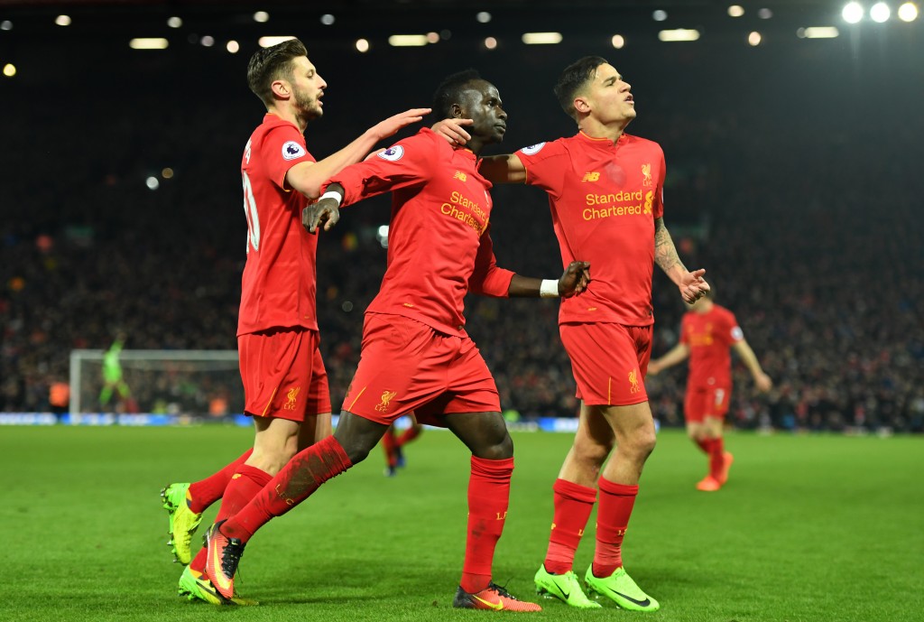 LIVERPOOL, ENGLAND - FEBRUARY 11: Sadio Mane (C) of Liverpool celebrates scoring his side's second goal with his team mate Philippe Coutinho (R) and Adam Lallana (L) during the Premier League match between Liverpool and Tottenham Hotspur at Anfield on February 11, 2017 in Liverpool, England. (Photo by Mike Hewitt/Getty Images for Tottenham Hotspur FC)