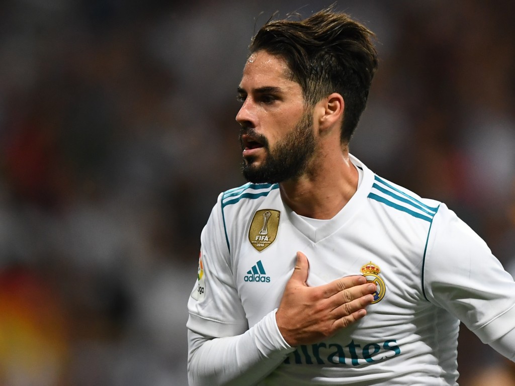 Real Madrid's midfielder Isco celebrates his second goal during the Spanish league football match Real Madrid CF vs RCD Espanyol at the Santiago Bernabeu stadium in Madrid on October 1, 2017. / AFP PHOTO / GABRIEL BOUYS (Photo credit should read GABRIEL BOUYS/AFP/Getty Images)