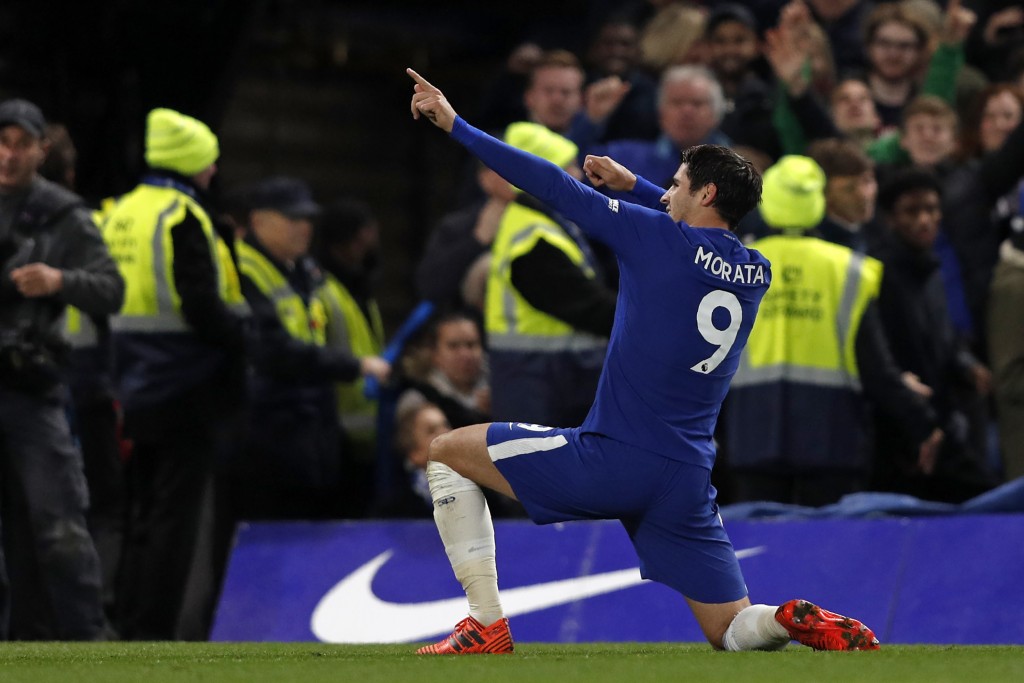 Chelsea's Spanish striker Alvaro Morata celebrates scoring the opening goal during the English Premier League football match between Chelsea and Manchester United at Stamford Bridge in London on November 5, 2017. / AFP PHOTO / Adrian DENNIS / RESTRICTED TO EDITORIAL USE. No use with unauthorized audio, video, data, fixture lists, club/league logos or 'live' services. Online in-match use limited to 75 images, no video emulation. No use in betting, games or single club/league/player publications. / (Photo credit should read ADRIAN DENNIS/AFP/Getty Images)