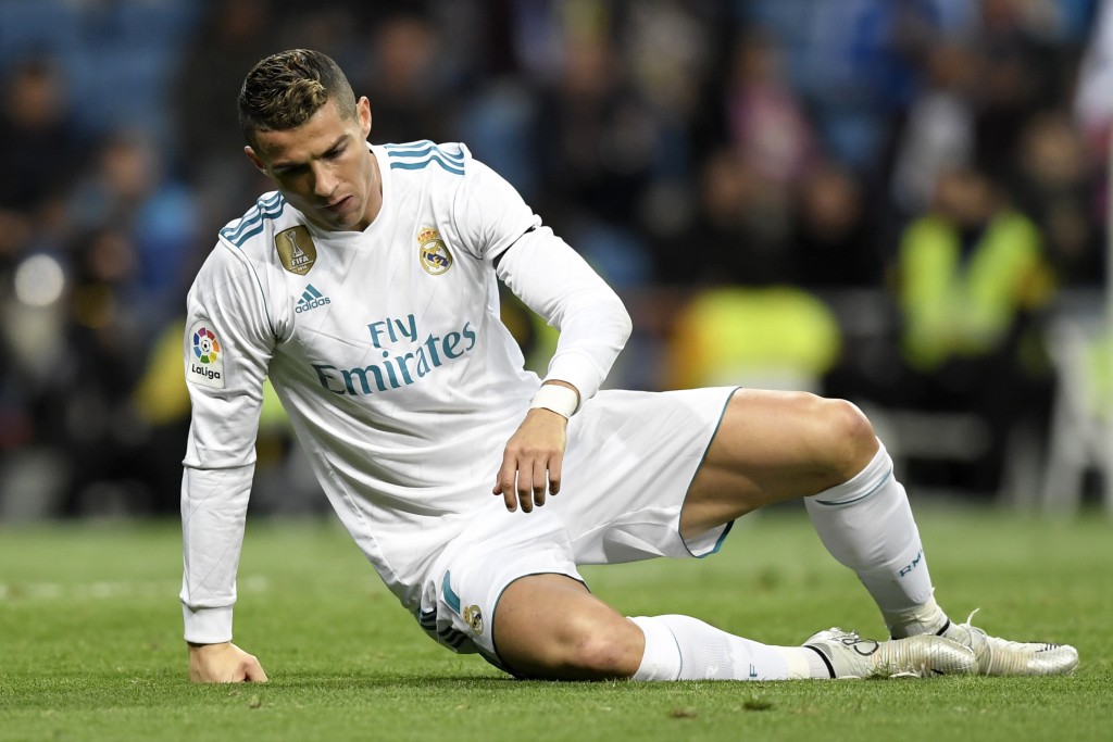 Real Madrid's Portuguese forward Cristiano Ronaldo gets up after falling during the Spanish league football match Real Madrid CF vs UD Las Palmas at the Santiago Bernabeu stadium in Madrid on November 5, 2017. / AFP PHOTO / GABRIEL BOUYS (Photo credit should read GABRIEL BOUYS/AFP/Getty Images)