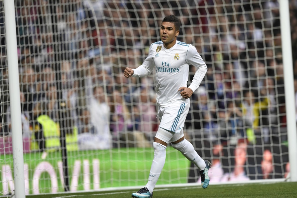Real Madrid's Brazilian midfielder Casemiro celebrates after scoring during the Spanish league football match Real Madrid CF against Malaga CF on 25, November 2017 at the Santiago Bernabeu stadium in Madrid. / AFP PHOTO / GABRIEL BOUYS (Photo credit should read GABRIEL BOUYS/AFP/Getty Images)