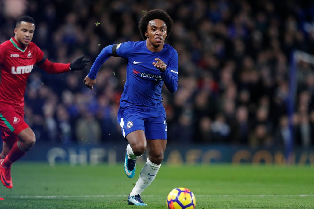 Chelsea's Brazilian midfielder Willian runs with the ball during the English Premier League football match between Chelsea and Swansea City at Stamford Bridge in London on November 29, 2017. / AFP PHOTO / Adrian DENNIS / RESTRICTED TO EDITORIAL USE. No use with unauthorized audio, video, data, fixture lists, club/league logos or 'live' services. Online in-match use limited to 75 images, no video emulation. No use in betting, games or single club/league/player publications. / (Photo credit should read ADRIAN DENNIS/AFP/Getty Images)