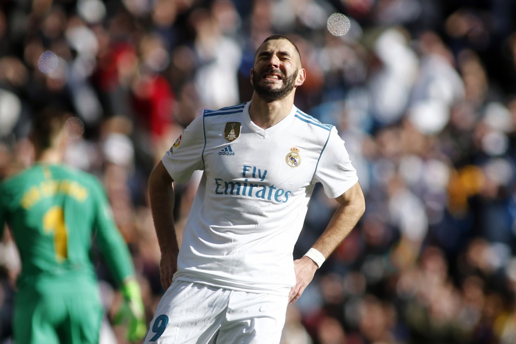 Real Madrid's French forward Karim Benzema reacts during the Spanish League "Clasico" football match Real Madrid CF vs FC Barcelona at the Santiago Bernabeu stadium in Madrid on December 23, 2017. / AFP PHOTO / OSCAR DEL POZO (Photo credit should read OSCAR DEL POZO/AFP/Getty Images)