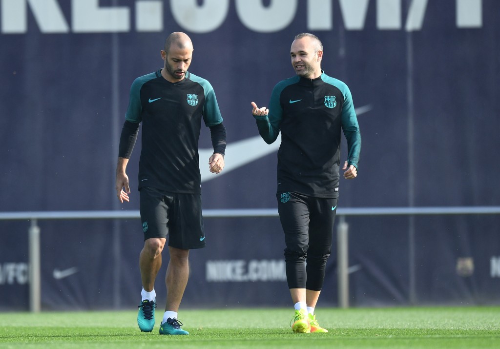 BARCELONA, SPAIN - OCTOBER 18: (L-R) Javier Mascherano of Barcelona and Andres Iniesta of Barcelona chat during the FC Barcelona training session at Ciutat Esportiva Joan Gamper on October 18, 2016 in Barcelona, Spain. (Photo by David Ramos/Getty Images)