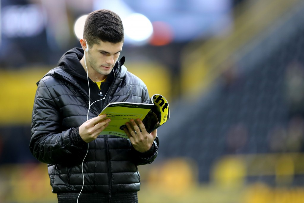 DORTMUND, GERMANY - NOVEMBER 25: Christian Pulisic of Dortmund reads a magazin prior to the Bundesliga match between Borussia Dortmund and FC Schalke 04 at Signal Iduna Park on November 25, 2017 in Dortmund, Germany. (Photo by Christof Koepsel/Bongarts/Getty Images)