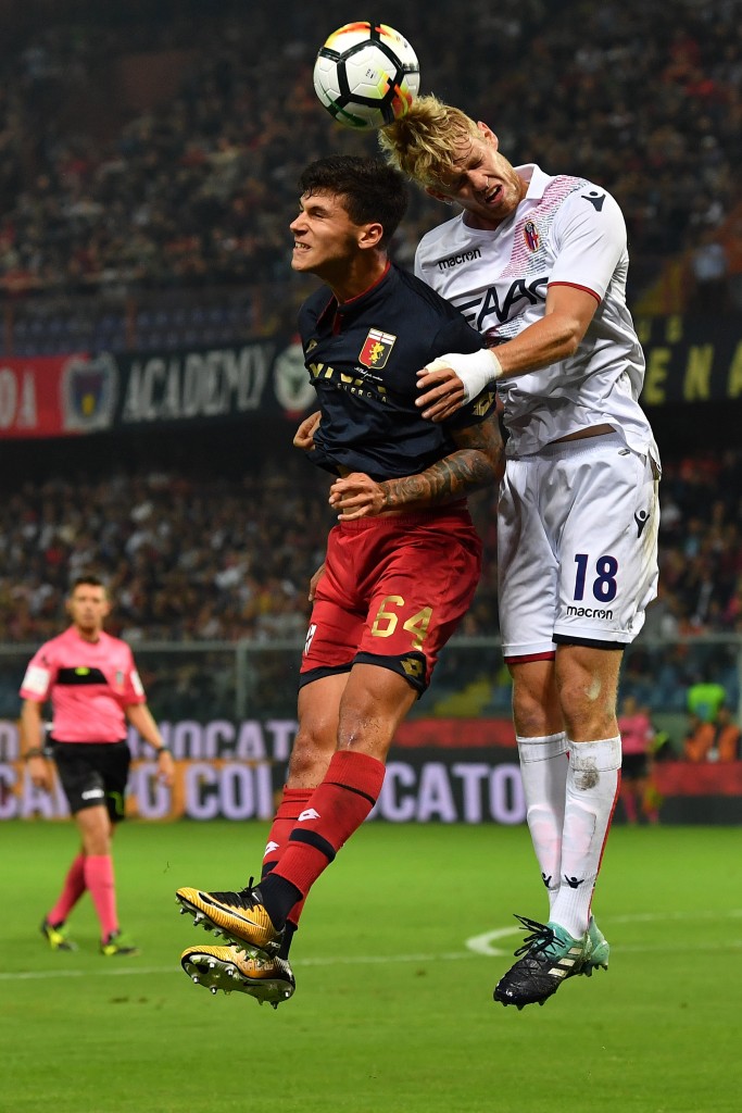 GENOA, ITALY - SEPTEMBER 30: Pietro Pellegri (L) of Genoa CFC clashes with Filip Helander of Bologna FC during the Serie A match between Genoa CFC and Bologna FC at Stadio Luigi Ferraris on September 30, 2017 in Genoa, Italy. (Photo by Valerio Pennicino/Getty Images)