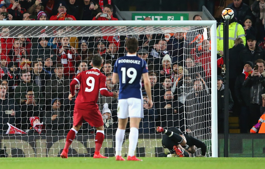 LIVERPOOL, ENGLAND - JANUARY 27: Roberto Firmino of Liverpool watches on as he sees his VAR awarded penalty kick strike the crossbar during The Emirates FA Cup Fourth Round match between Liverpool and West Bromwich Albion at Anfield on January 27, 2018 in Liverpool, England. (Photo by Alex Livesey/Getty Images)