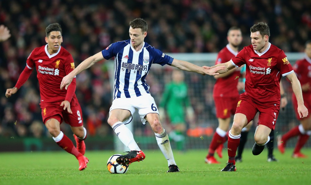 LIVERPOOL, ENGLAND - JANUARY 27: Jonny Evans of West Bromwich Albion holds off James Milner of Liverpool during The Emirates FA Cup Fourth Round match between Liverpool and West Bromwich Albion at Anfield on January 27, 2018 in Liverpool, England. (Photo by Alex Livesey/Getty Images)