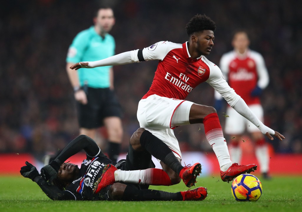 LONDON, ENGLAND - JANUARY 20: Wilfried Zaha of Crystal Palace tackles Ainsley Maitland-Niles of Arsenal during the Premier League match between Arsenal and Crystal Palace at Emirates Stadium on January 20, 2018 in London, England. (Photo by Clive Mason/Getty Images)