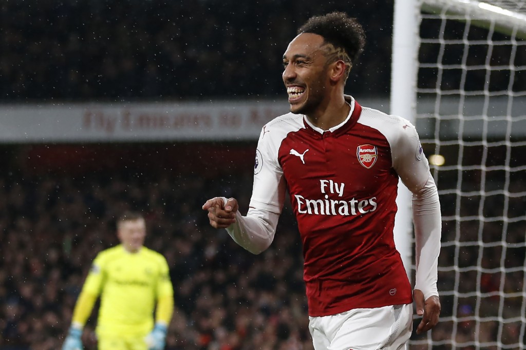 Arsenal's Gabonese striker Pierre-Emerick Aubameyang celebrates scoring the team's fourth goal during the English Premier League football match between Arsenal and Everton at the Emirates Stadium in London on February 3, 2018. / AFP PHOTO / IKIMAGES / Ian KINGTON / RESTRICTED TO EDITORIAL USE. No use with unauthorized audio, video, data, fixture lists, club/league logos or 'live' services. Online in-match use limited to 45 images, no video emulation. No use in betting, games or single club/league/player publications. / (Photo credit should read IAN KINGTON/AFP/Getty Images)