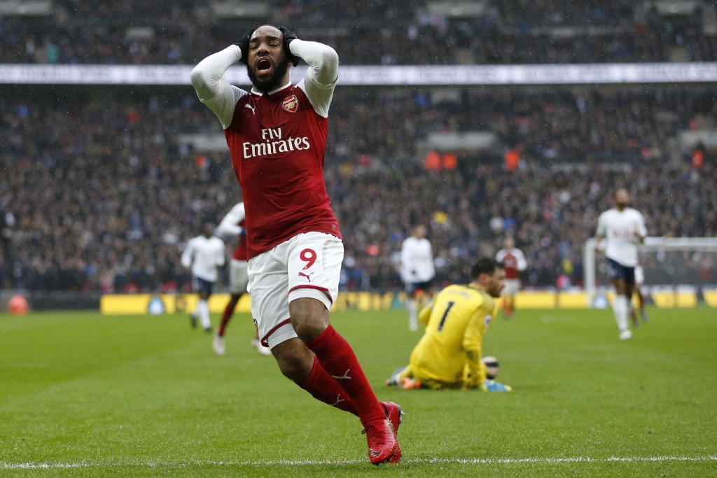 Arsenal's French striker Alexandre Lacazette reacts after missing a chance during the English Premier League football match between Tottenham Hotspur and Arsenal at Wembley Stadium in London, on February 10, 2018. / AFP PHOTO / IKIMAGES / Ian KINGTON / RESTRICTED TO EDITORIAL USE. No use with unauthorized audio, video, data, fixture lists, club/league logos or 'live' services. Online in-match use limited to 45 images, no video emulation. No use in betting, games or single club/league/player publications. / (Photo credit should read IAN KINGTON/AFP/Getty Images)