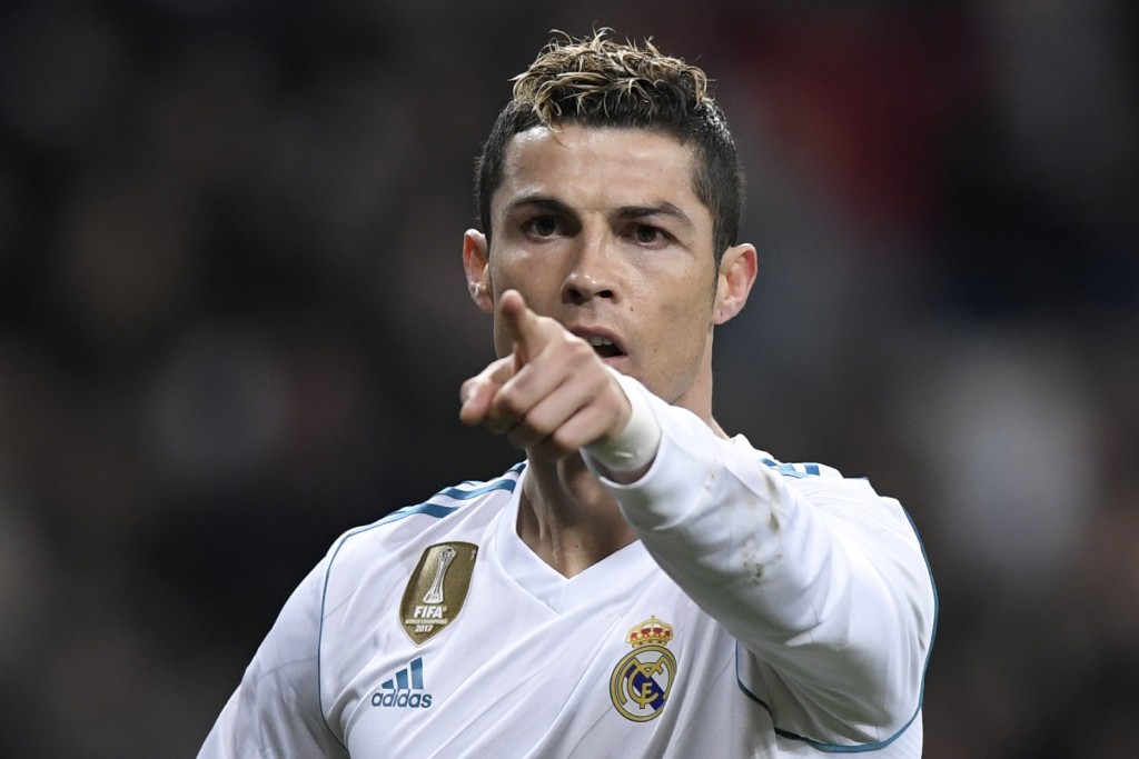 Real Madrid's Portuguese forward Cristiano Ronaldo celebrates after scoring during the Spanish league football match between Real Madrid CF and Real Sociedad at the Santiago Bernabeu stadium in Madrid on February 10, 2018. / AFP PHOTO / GABRIEL BOUYS (Photo credit should read GABRIEL BOUYS/AFP/Getty Images)