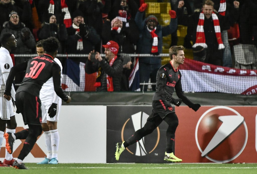 Arsenal's Nacho Monreal (R) celebrates after scoring the 0-1 during the UEFA Europa League round of 32, first leg football match of Ostersund FK vs Arsenal FC on February 15, 2018 in Ostersund, Sweden. / AFP PHOTO / TT NEWS AGENCY / Robert HENRIKSSON / Sweden OUT (Photo credit should read ROBERT HENRIKSSON/AFP/Getty Images)