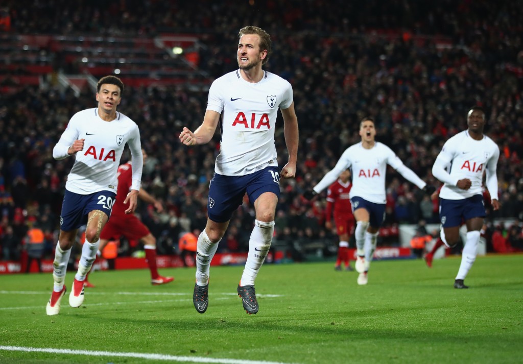 LIVERPOOL, ENGLAND - FEBRUARY 04: Harry Kane of Tottenham Hotspur celebrates after scoring his sides second goal and his 100th Premier League goal during the Premier League match between Liverpool and Tottenham Hotspur at Anfield on February 4, 2018 in Liverpool, England. (Photo by Clive Brunskill/Getty Images)