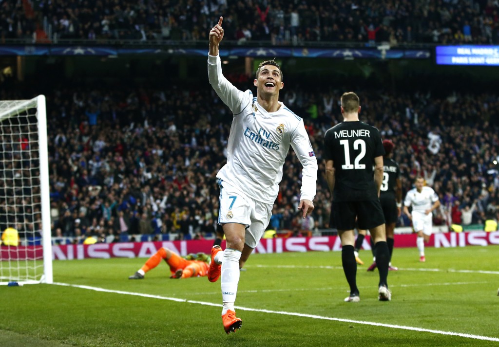 MADRID, SPAIN - FEBRUARY 14: Cristiano Ronaldo of Real Madrid celebrates scoring the 2nd Real Madrid goal during the UEFA Champions League Round of 16 First Leg match between Real Madrid and Paris Saint-Germain at Bernabeu on February 14, 2018 in Madrid, Spain. (Photo by Gonzalo Arroyo Moreno/Getty Images)