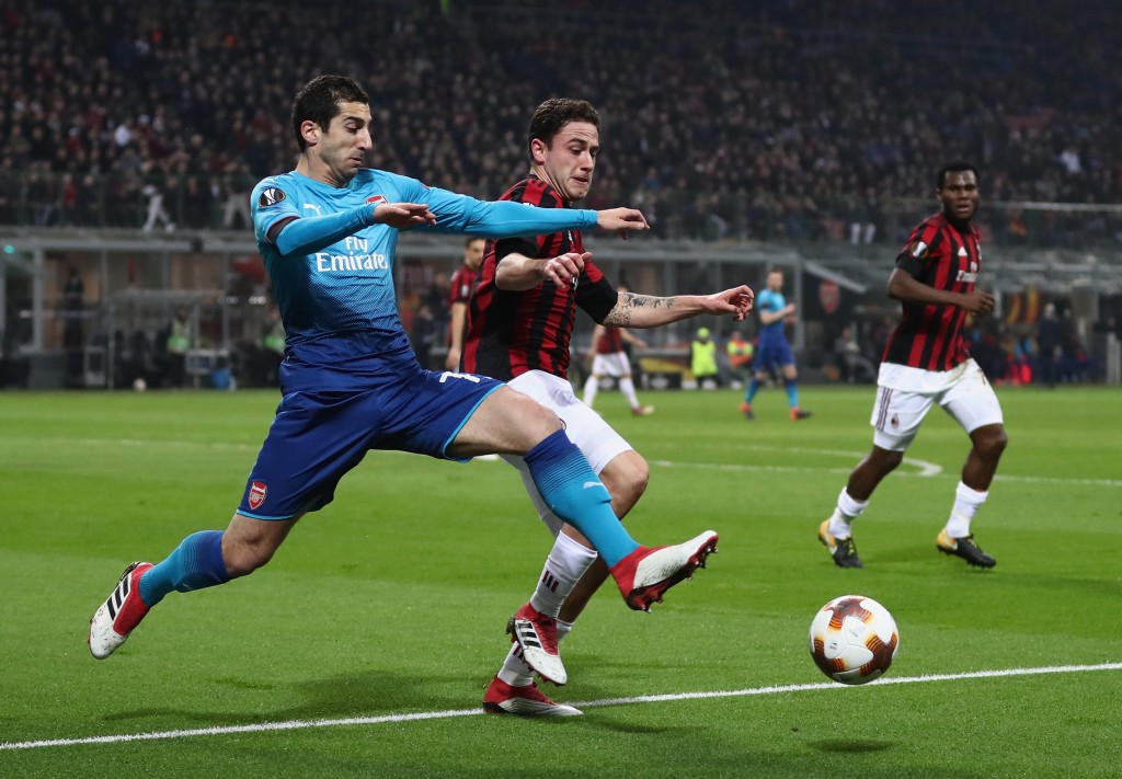 MILAN, ITALY - MARCH 08: Henrikh Mkhitaryan of Arsenal is tackled by Davide Calabria of AC Milan during the UEFA Europa League Round of 16 match between AC Milan and Arsenal at the San Siro on March 8, 2018 in Milan, Italy. (Photo by Catherine Ivill/Getty Images)