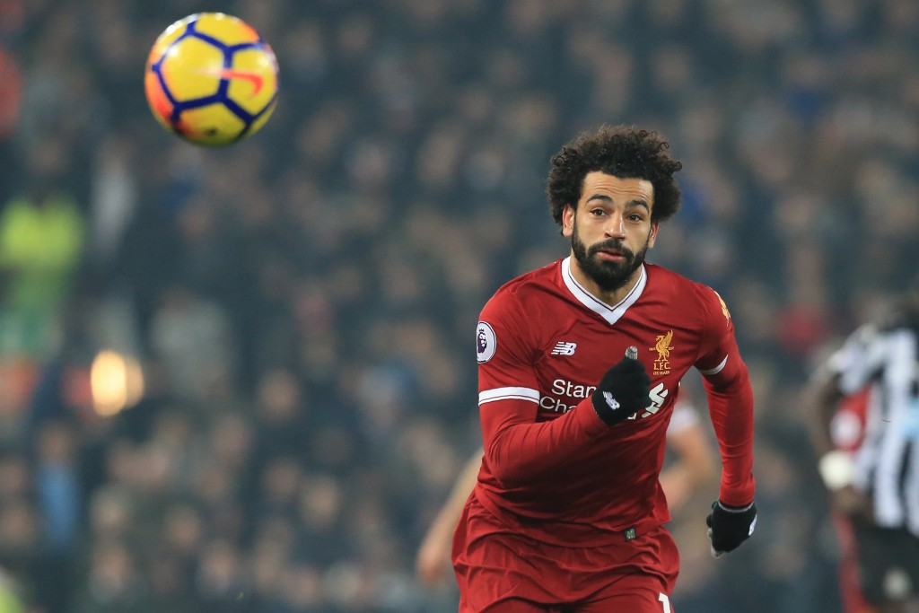 Liverpool's Egyptian midfielder Mohamed Salah chases the ball during the English Premier League football match between Liverpool and Newcastle at Anfield in Liverpool, north west England on March 3, 2018. / AFP PHOTO / Lindsey PARNABY / RESTRICTED TO EDITORIAL USE. No use with unauthorized audio, video, data, fixture lists, club/league logos or 'live' services. Online in-match use limited to 75 images, no video emulation. No use in betting, games or single club/league/player publications. / (Photo credit should read LINDSEY PARNABY/AFP/Getty Images)
