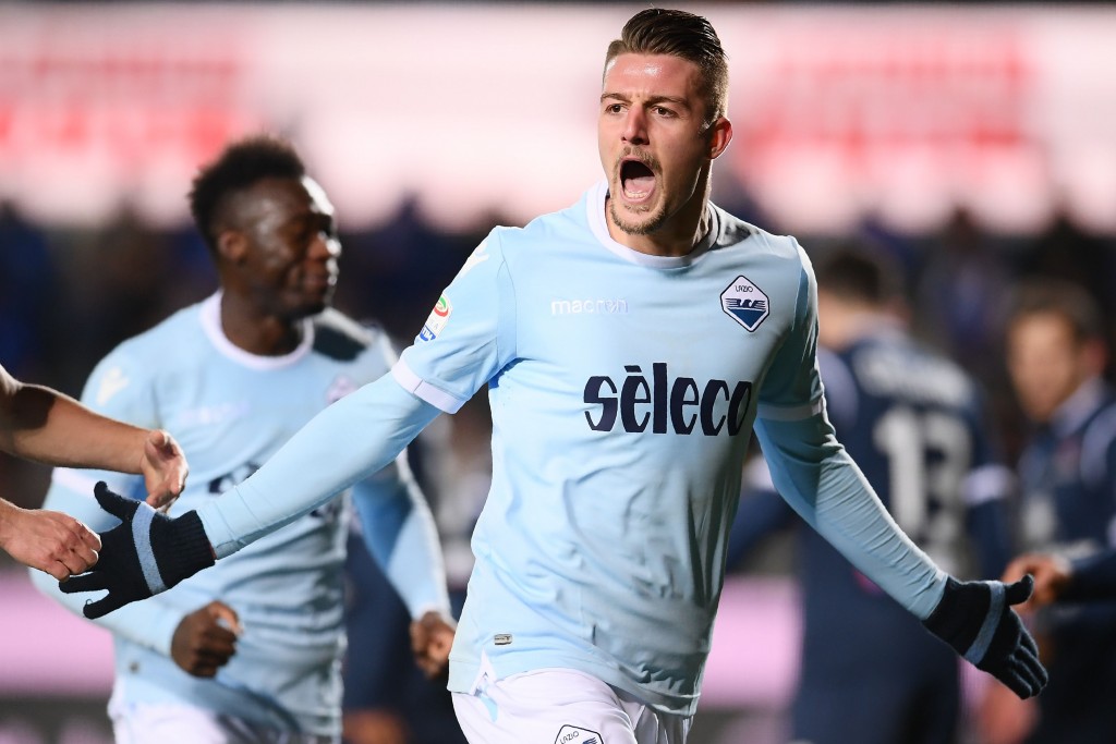 Lazio's midfielder Sergej Milinkovic-Savic from Serbia (R) celebrates after scoring during the Italian Serie A football match Atalanta vs Lazio at the 'Atleti Azzurri d'Italia' stadium in Bergamo on December 17, 2017. / AFP PHOTO / MARCO BERTORELLO (Photo credit should read MARCO BERTORELLO/AFP/Getty Images)