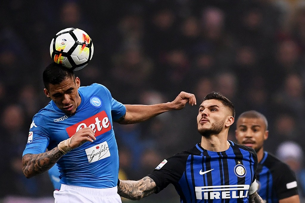 Napoli's midfielder Allan from Brazil (L) jumps for the ball with Inter Milan's forward Mauro Emanuel Icardi from Argentina during the Italian Serie A football match between Inter Milan and Napoli on March 11, 2018, at the San Siro Stadium in Milan. / AFP PHOTO / MARCO BERTORELLO (Photo credit should read MARCO BERTORELLO/AFP/Getty Images)