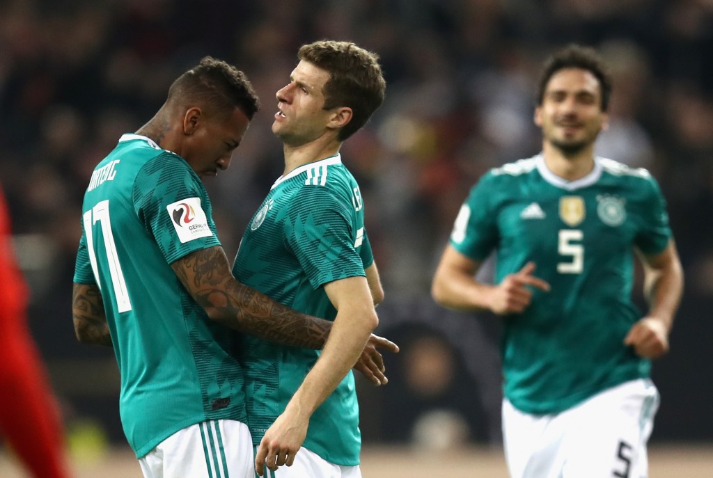 DUESSELDORF, GERMANY - MARCH 23: Thomas Mueller of Germany celebrates with teammate Jerome Boateng after scoring his sides first goal during the International friendly match between Germany and Spain at Esprit-Arena on March 23, 2018 in Duesseldorf, Germany. (Photo by Maja Hitij/Bongarts/Getty Images)