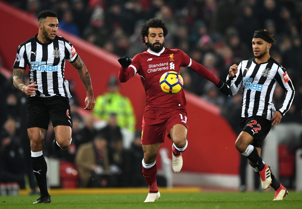 LIVERPOOL, ENGLAND - MARCH 03: Mohamed Salah of Liverpool is chased down by Jamaal Lascelles of Newcastle United during the Premier League match between Liverpool and Newcastle United at Anfield on March 3, 2018 in Liverpool, England. (Photo by Gareth Copley/Getty Images)