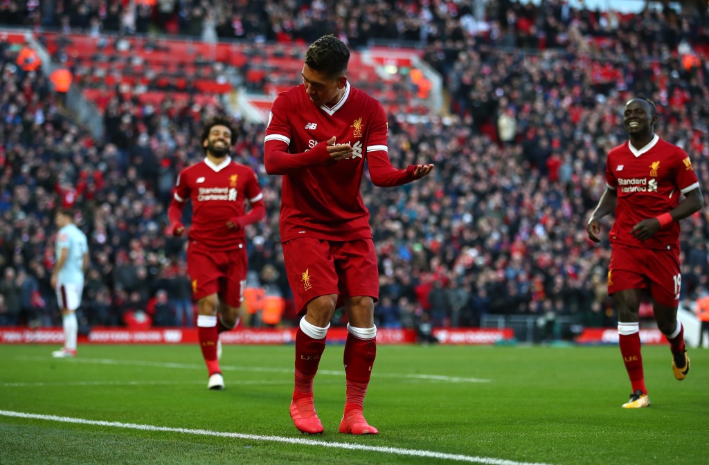 LIVERPOOL, ENGLAND - FEBRUARY 24: Roberto Firmino of Liverpool celebrates scoring his side's third goal during the Premier League match between Liverpool and West Ham United at Anfield on February 24, 2018 in Liverpool, England. (Photo by Clive Brunskill/Getty Images)