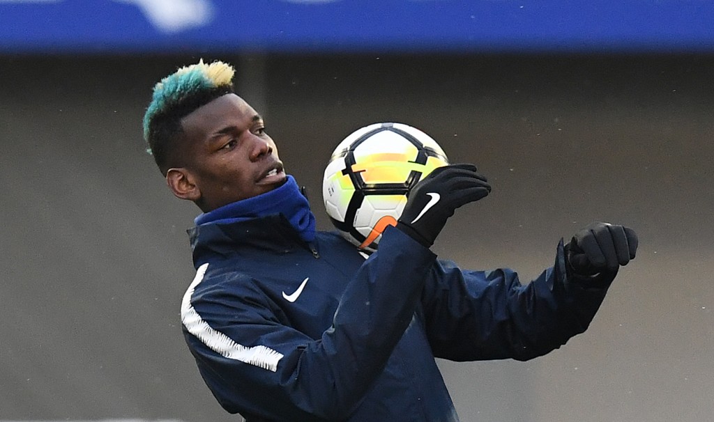 TOPSHOT - France's midfielder Paul Pogba controls the ball during a training session in Clairefontaine-en-Yvelines, southwest of Paris, on March 19, 2018, as part of the team's preparation for the friendly football matches against Colombia and Russia. / AFP PHOTO / FRANCK FIFE (Photo credit should read FRANCK FIFE/AFP/Getty Images)