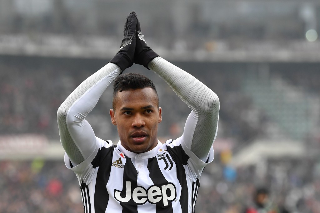 TURIN, ITALY - FEBRUARY 18: Alex Sandro of Juventus celebrates victory at the end of the Serie A match between Torino FC and Juventus at Stadio Olimpico di Torino on February 18, 2018 in Turin, Italy. (Photo by Valerio Pennicino/Getty Images)