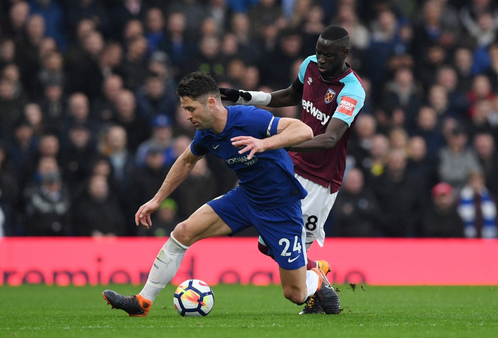 LONDON, ENGLAND - APRIL 08: Gary Cahill of Chelsea and Cheikhou Kouyate of West Ham United battle for possession during the Premier League match between Chelsea and West Ham United at Stamford Bridge on April 8, 2018 in London, England. (Photo by Shaun Botterill/Getty Images)