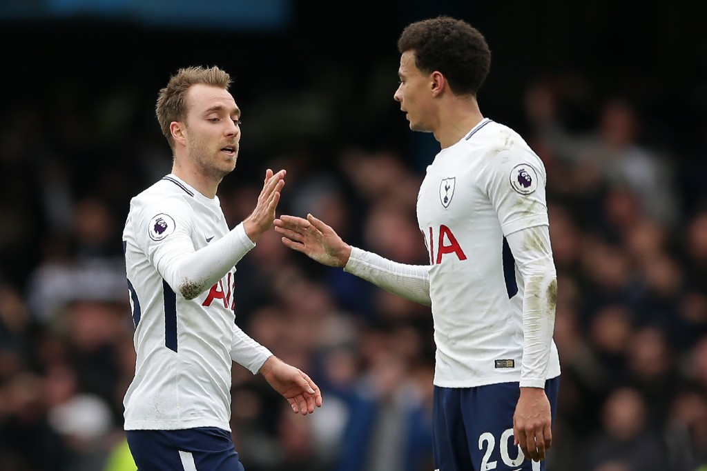 Tottenham Hotspur's Danish midfielder Christian Eriksen (L) celebrates with Tottenham Hotspur's English midfielder Dele Alli after scoring their first goal during the English Premier League football match between Chelsea and Tottenham Hotspur at Stamford Bridge in London on April 1, 2018. / AFP PHOTO / Daniel LEAL-OLIVAS / RESTRICTED TO EDITORIAL USE. No use with unauthorized audio, video, data, fixture lists, club/league logos or 'live' services. Online in-match use limited to 75 images, no video emulation. No use in betting, games or single club/league/player publications. / (Photo credit should read DANIEL LEAL-OLIVAS/AFP/Getty Images)