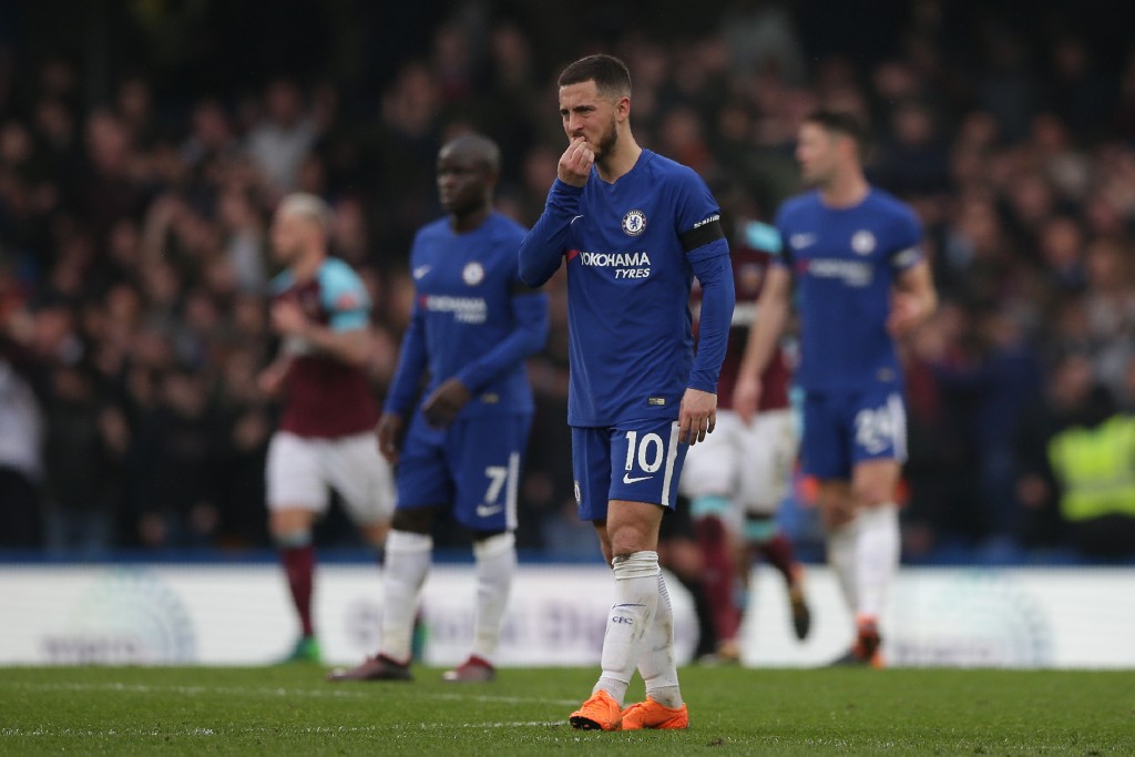 Chelsea's Belgian midfielder Eden Hazard reacts after they concede the Wets Ham goal during the English Premier League football match between Chelsea and West Ham United at Stamford Bridge in London on April 8, 2018. / AFP PHOTO / Daniel LEAL-OLIVAS / RESTRICTED TO EDITORIAL USE. No use with unauthorized audio, video, data, fixture lists, club/league logos or 'live' services. Online in-match use limited to 75 images, no video emulation. No use in betting, games or single club/league/player publications. / (Photo credit should read DANIEL LEAL-OLIVAS/AFP/Getty Images)