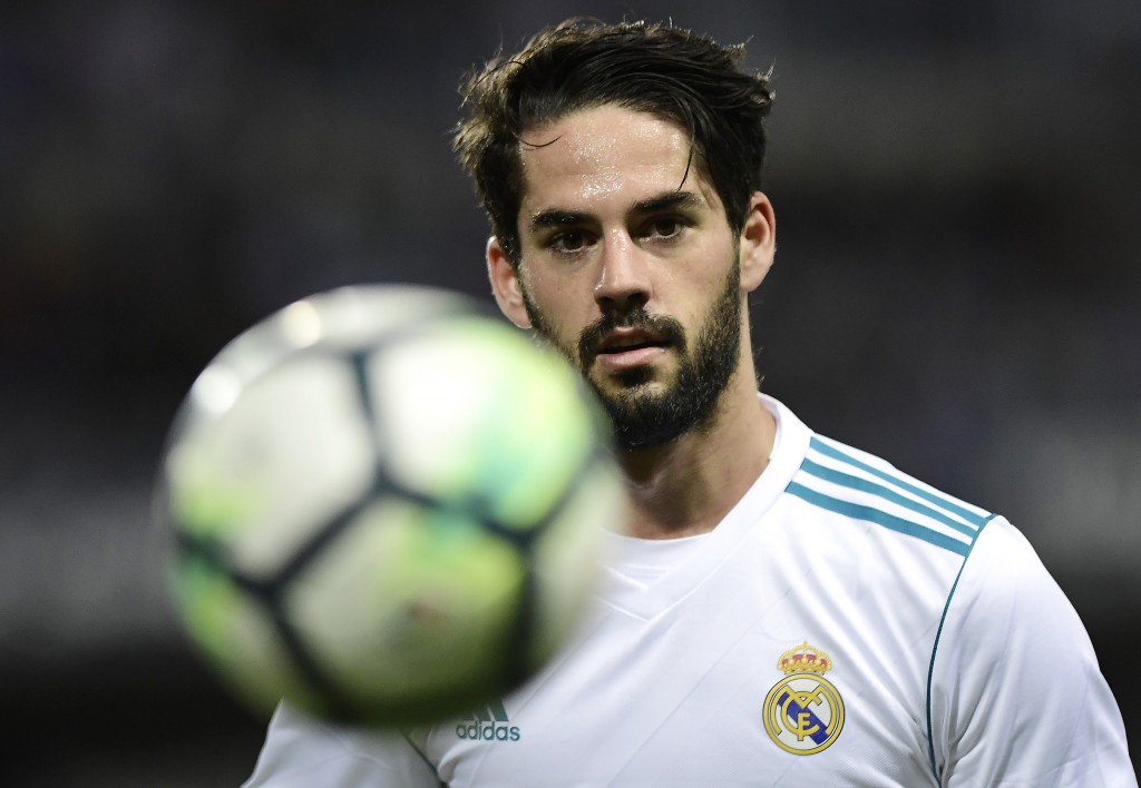 Real Madrid's Spanish midfielder Isco eyes the ball during the Spanish league footbal match between Malaga CF and Real Madrid CF at La Rosaleda stadium in Malaga on April 15, 2018. / AFP PHOTO / JORGE GUERRERO (Photo credit should read JORGE GUERRERO/AFP/Getty Images)