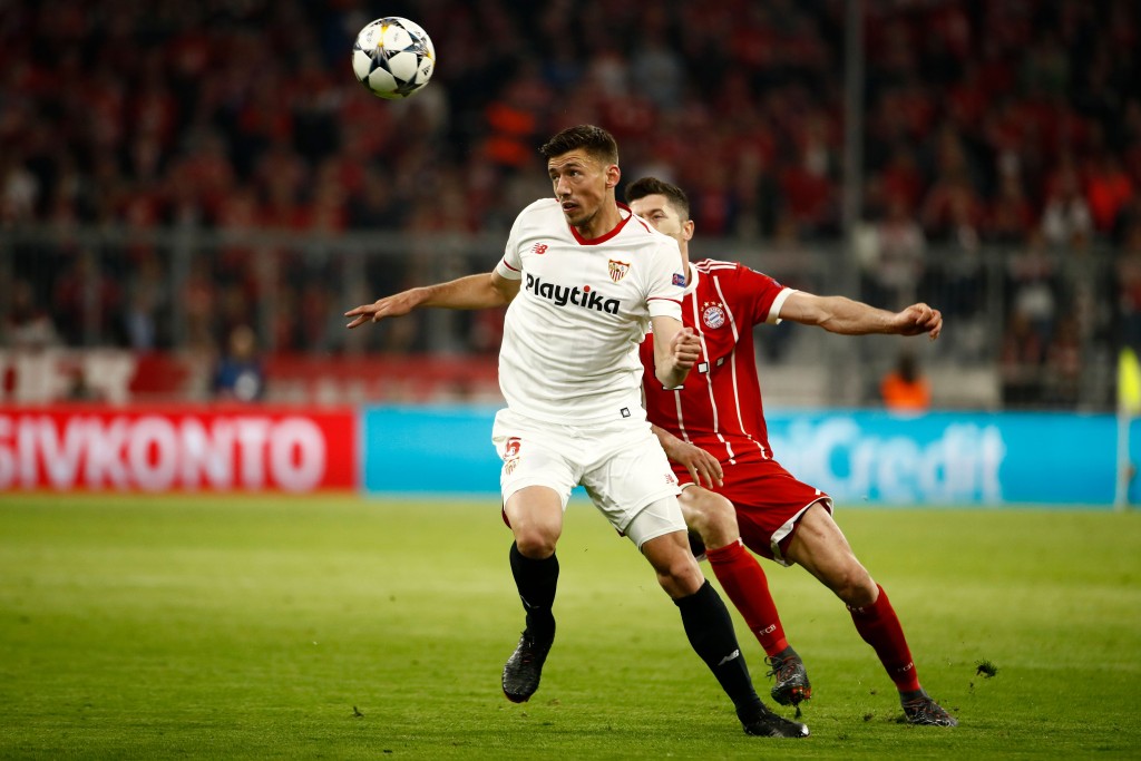 Sevilla's French defender Clement Lenglet (L) vies with Bayern Munich's Polish forward Robert Lewandowski during the UEFA Champions League quarter-final second leg football match between Bayern Munich and Sevilla FC on April 11, 2018 in Munich, southern Germany. / AFP PHOTO / Odd ANDERSEN (Photo credit should read ODD ANDERSEN/AFP/Getty Images)